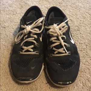 Black Nike athletic shoes
